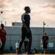a group of young men playing a game of frisbee
