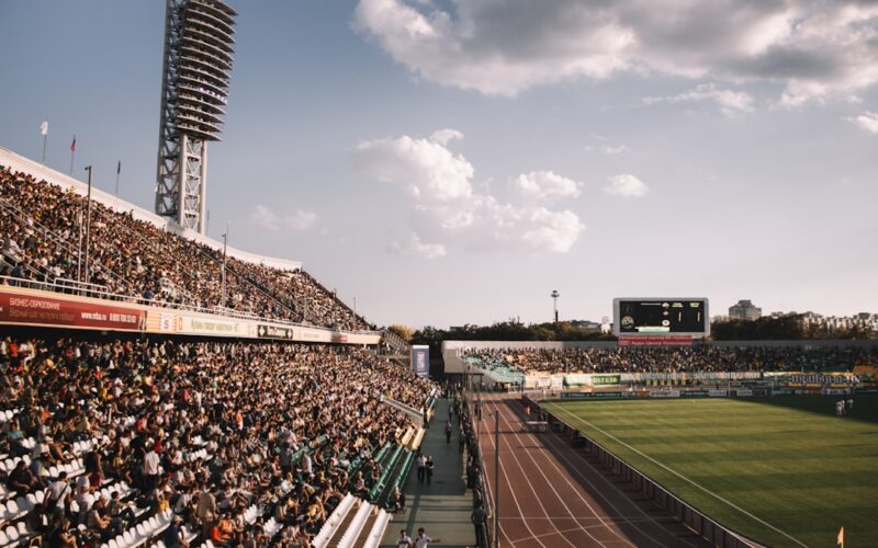 people on stadium during daytime