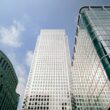 a couple of tall buildings sitting next to each other
