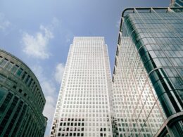 a couple of tall buildings sitting next to each other