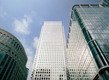 a couple of tall buildings sitting next to each other