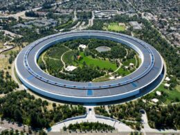 An aerial view of a circular building in a city