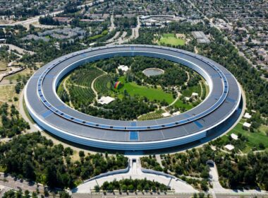 An aerial view of a circular building in a city