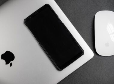 a cell phone next to a mouse