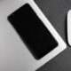 a cell phone next to a mouse