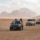 black car on brown sand during daytime
