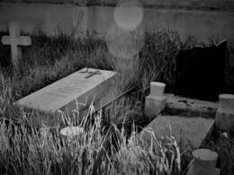 a black and white photo of a cemetery