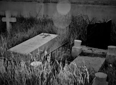 a black and white photo of a cemetery