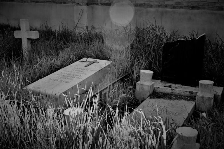 a black and white photo of a cemetery