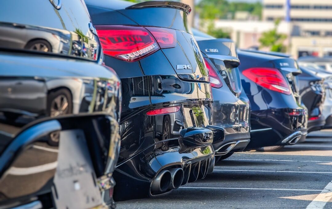 a row of parked cars in a parking lot
