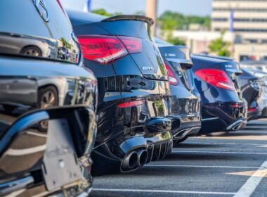 a row of parked cars in a parking lot
