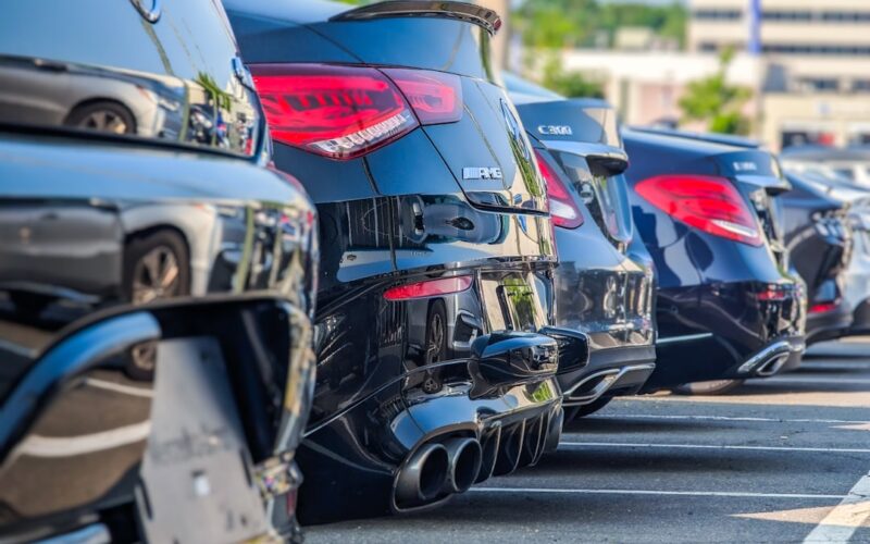 a row of parked cars in a parking lot
