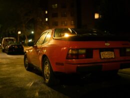 a red car parked on the side of the road