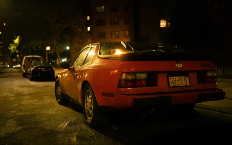 a red car parked on the side of the road