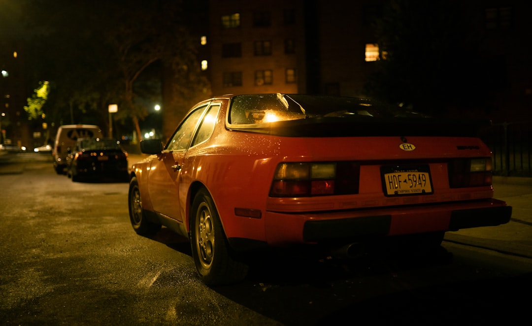 a red car parked on the side of the road