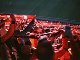 A large group of people sitting in a stadium