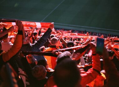 A large group of people sitting in a stadium