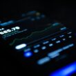 black android smartphone displaying 11 00