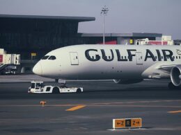 A large jetliner sitting on top of an airport tarmac