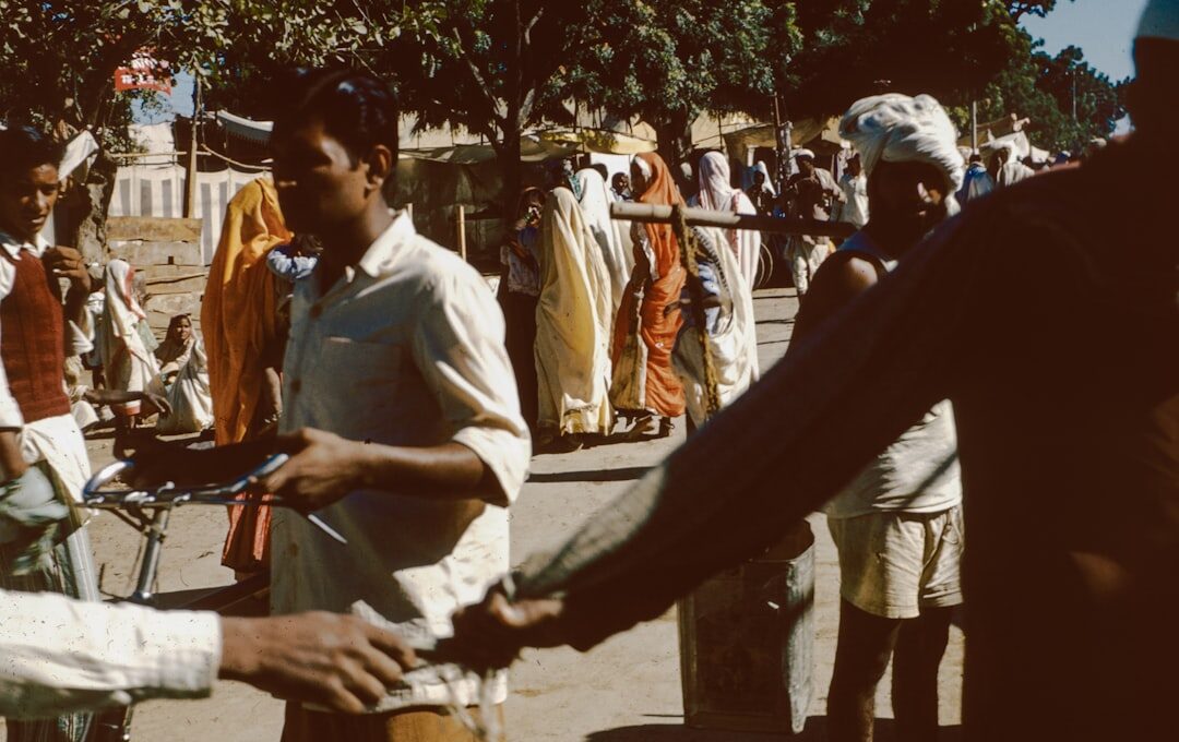 a group of people standing around each other