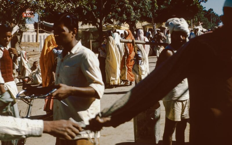 a group of people standing around each other