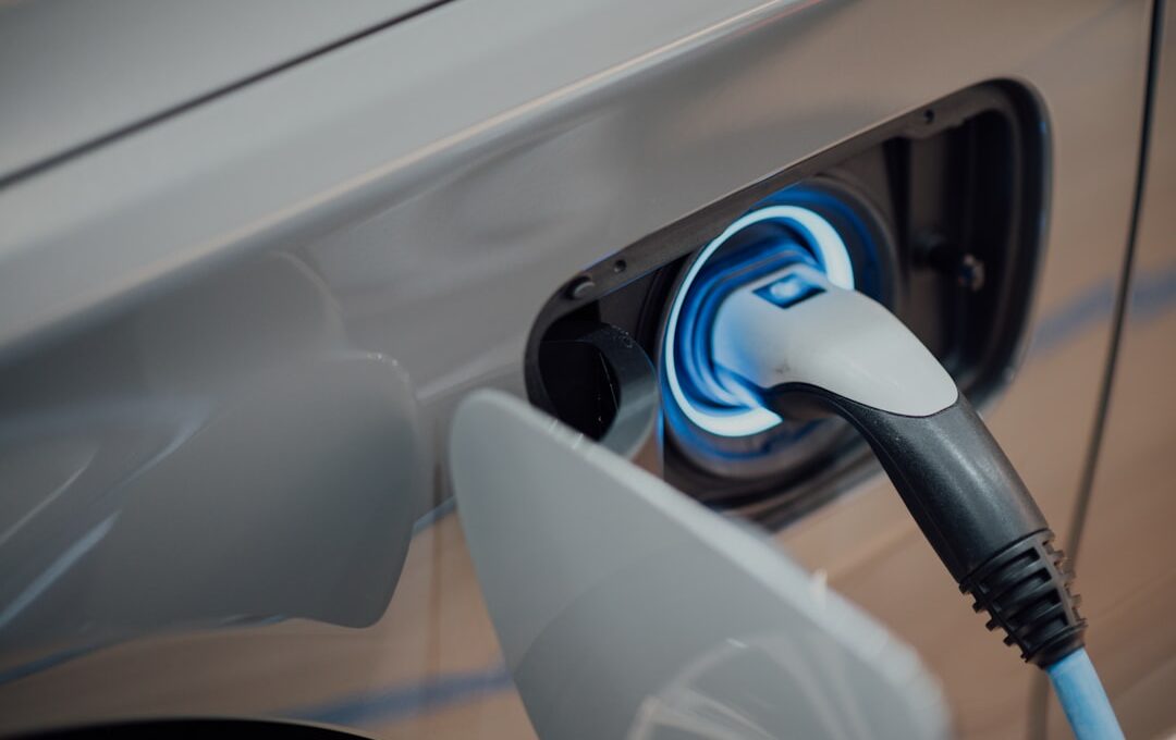 electric vehicle charger plugged into car