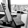 a table with a cell phone and a remote control on it