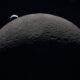 Earth rising over the moon's horizon