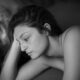 topless woman lying on bed