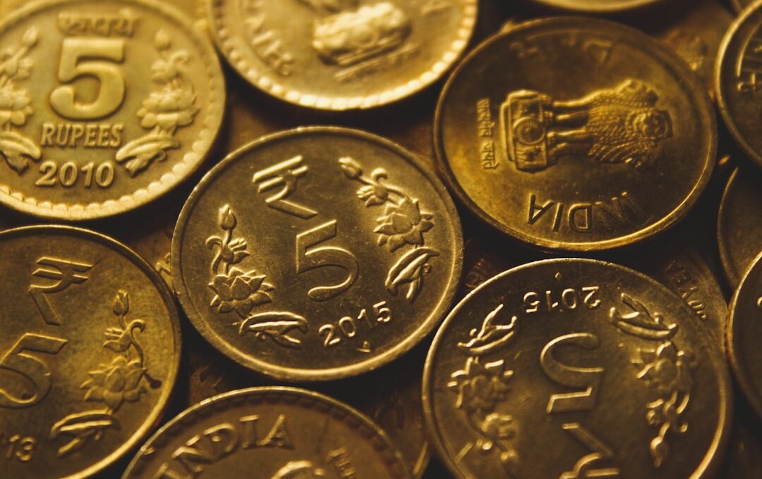 round gold-colored coin lot close-up photography