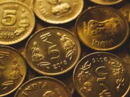 round gold-colored coin lot close-up photography