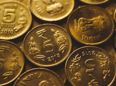 round gold-colored coin lot close-up photography