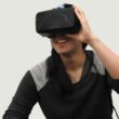 woman wearing black VR goggles