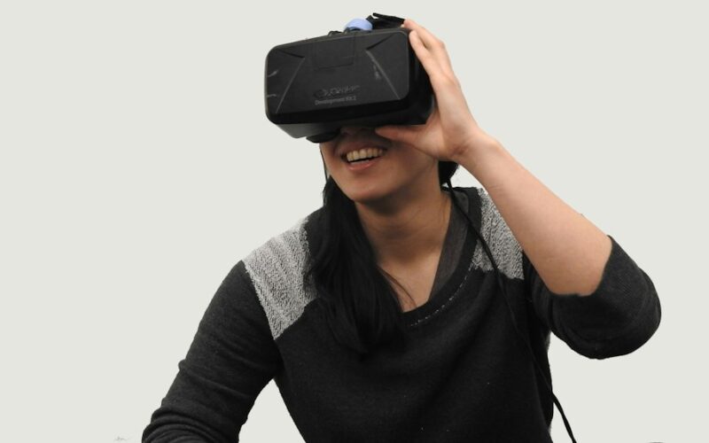 woman wearing black VR goggles