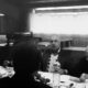 grayscale photo of men eating