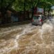 a car is driving through a flooded street