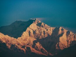 Jagged mountain peaks illuminated by golden sunlight