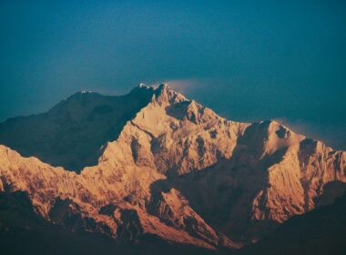 Jagged mountain peaks illuminated by golden sunlight