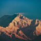 Jagged mountain peaks illuminated by golden sunlight
