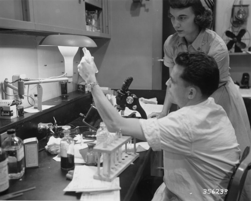 Two people working in a laboratory with equipment