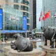 a statue of two bulls in front of a building