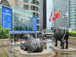 a statue of two bulls in front of a building