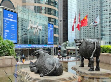 a statue of two bulls in front of a building