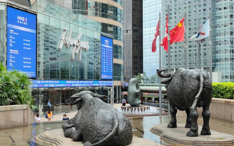 a statue of two bulls in front of a building