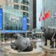 a statue of two bulls in front of a building