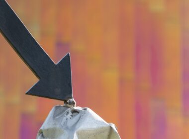 a close up of a metal object with an arrow on it