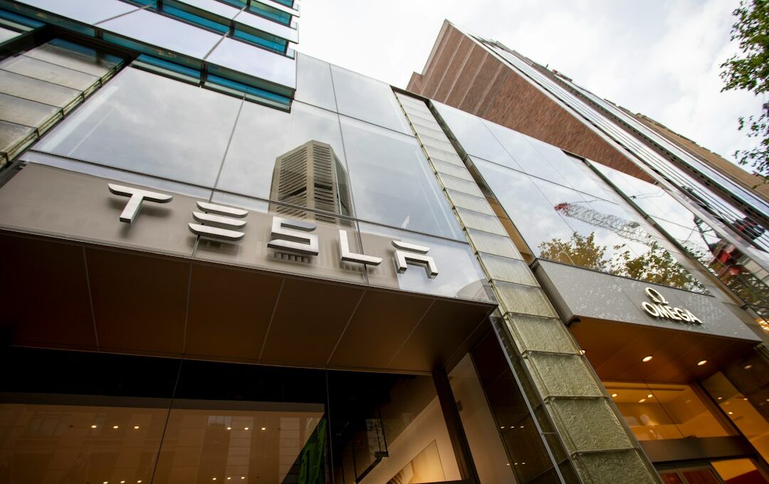 a tall building with a tesla sign on it's side