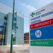 a hospital sign in front of a building