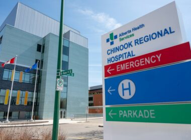 a hospital sign in front of a building