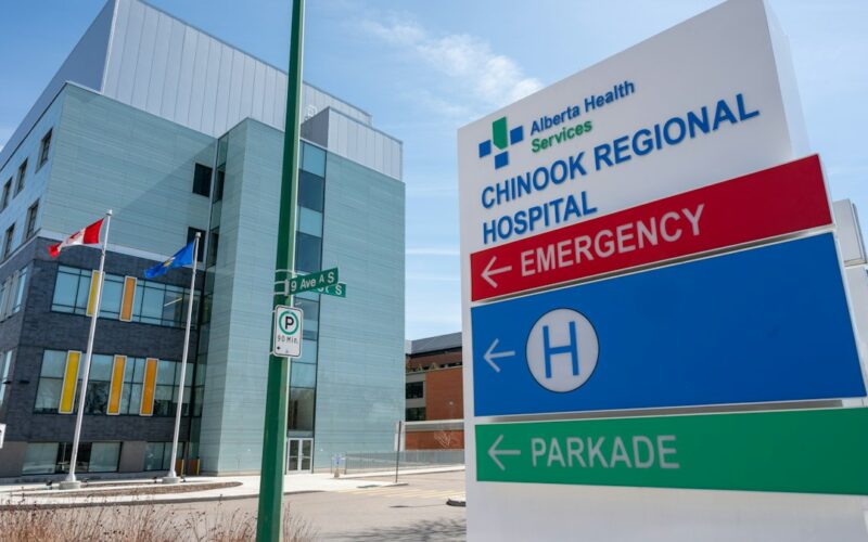 a hospital sign in front of a building